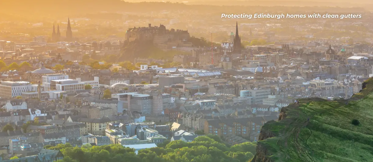 Edinburgh city skyline with Edinburgh Castle at sunset, promoting the importance of regular gutter cleaning to protect homes from damp and water damage.