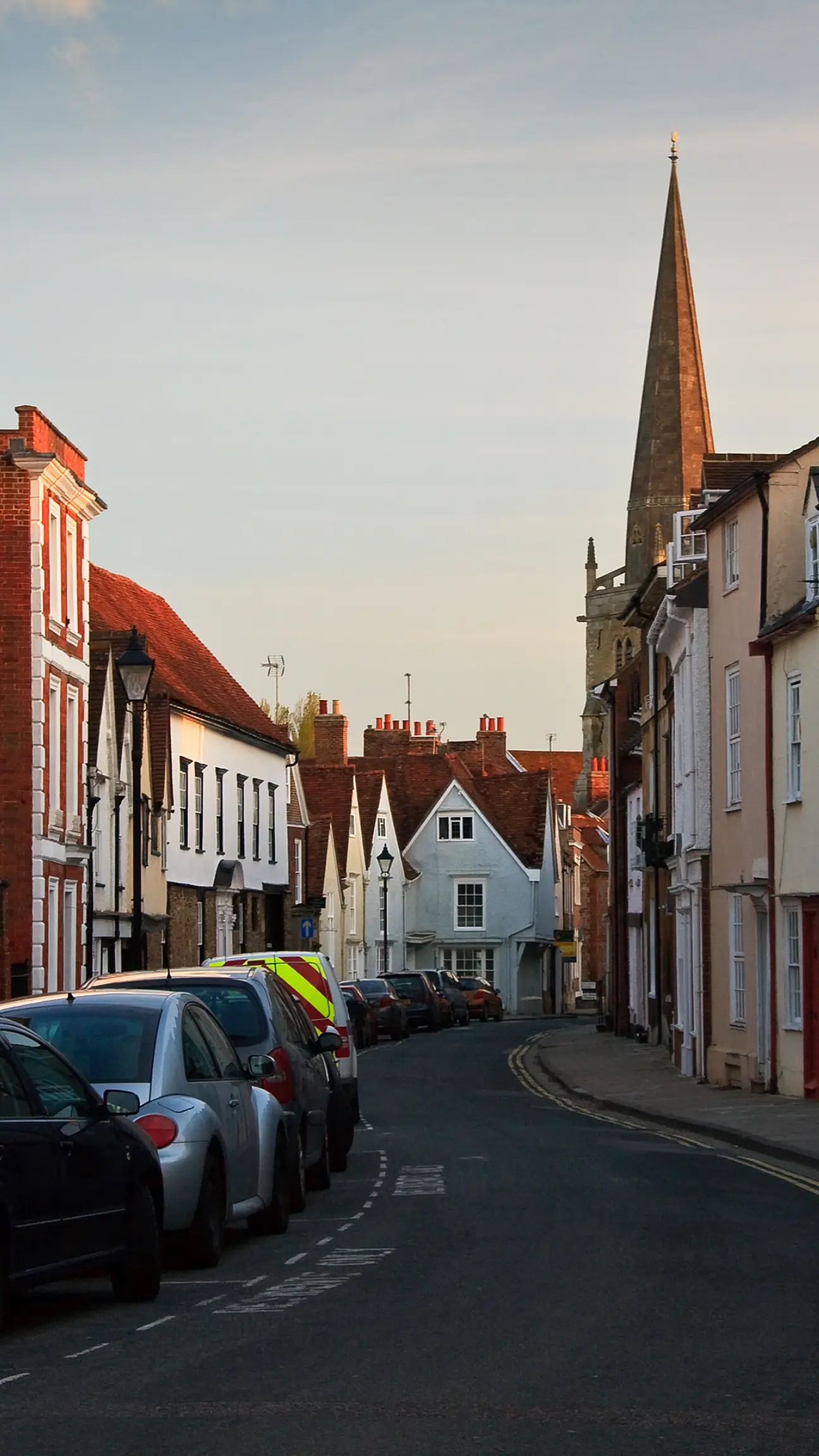 a portrait showing a street of Oxford, typically a cleaning zone for a gutter cleaner utilizing ladders to clean out these buildings