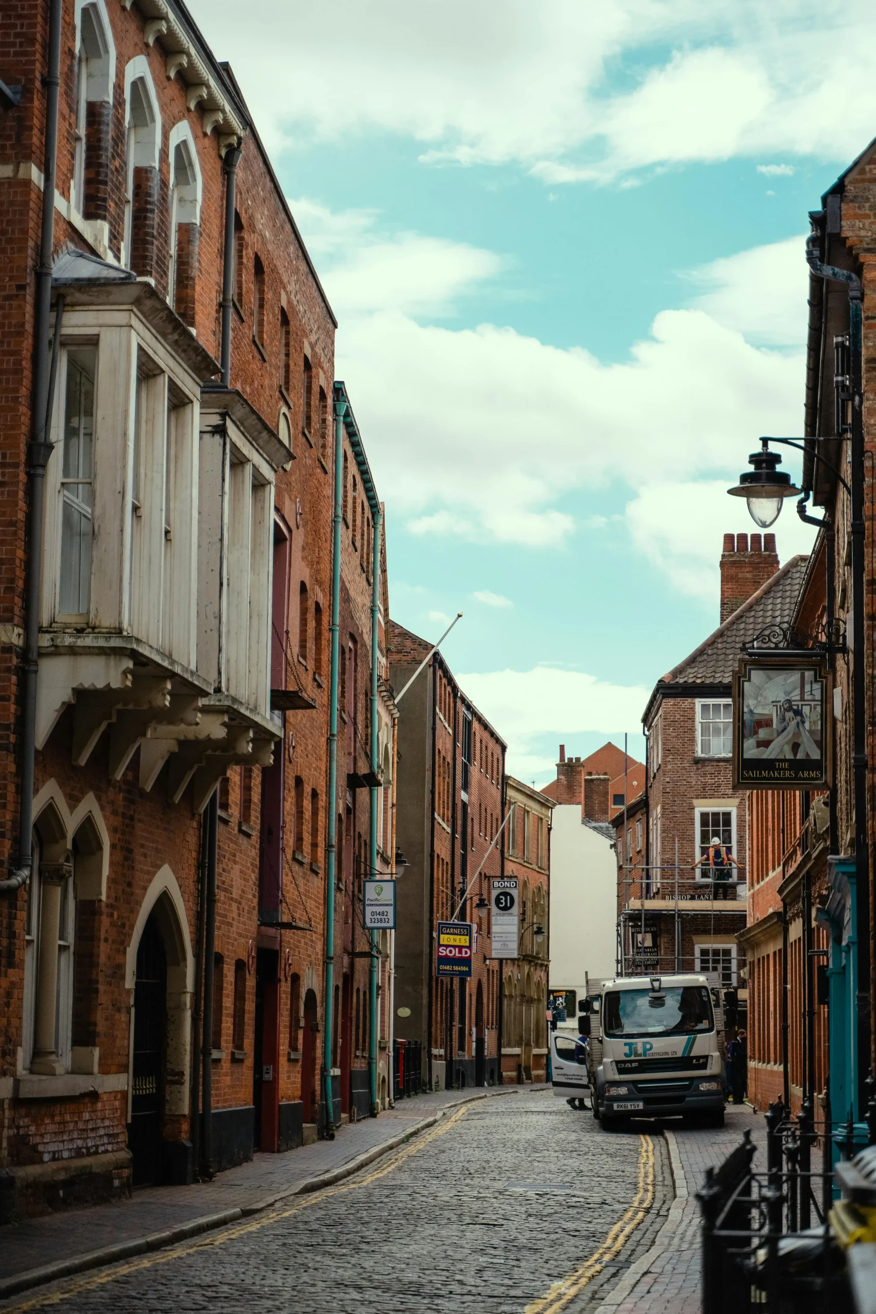 A street in Hull showing typical gutters and roofs that need cleaning in the area.