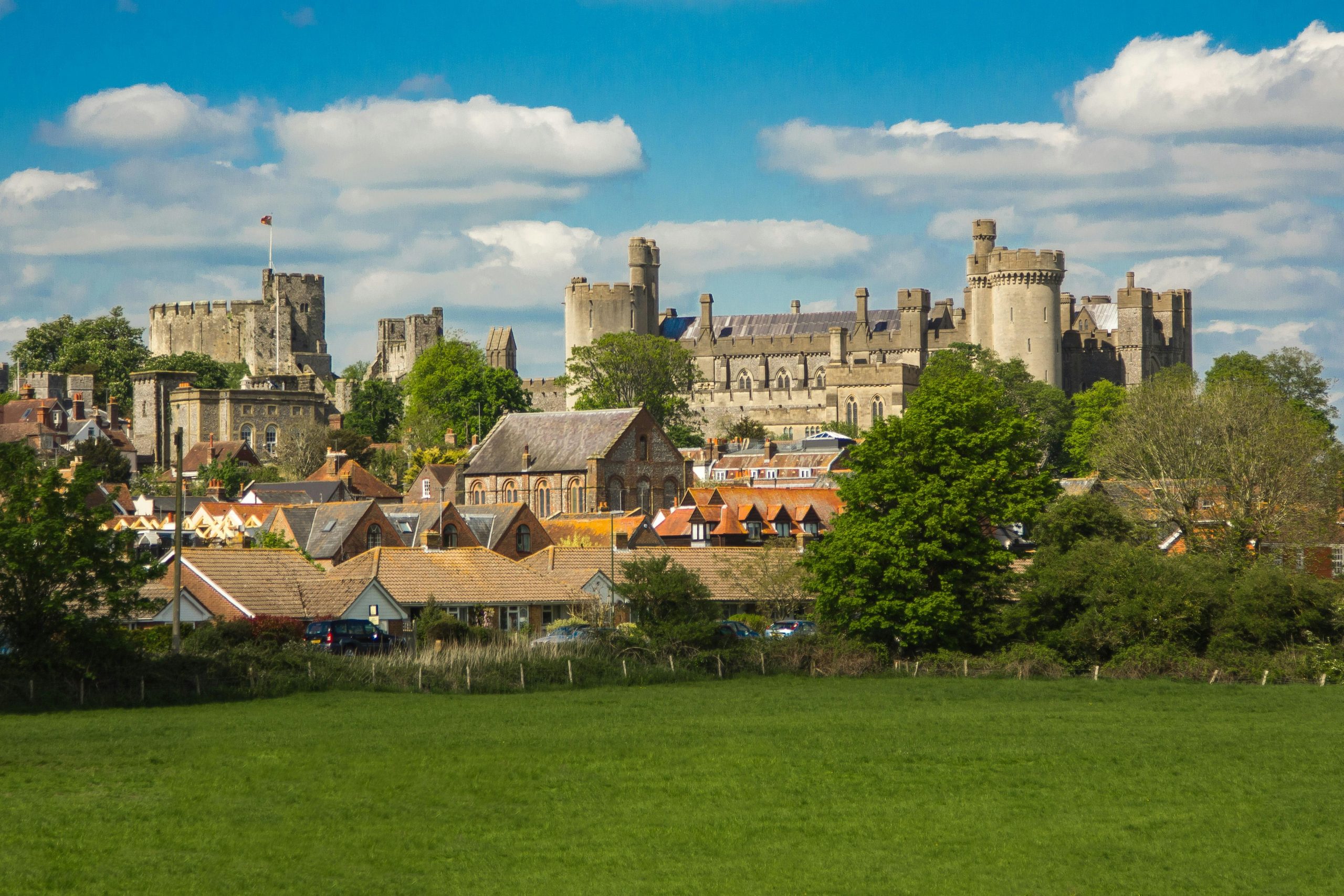 A small town area in West Sussex showing a collage of buildings for locational context for the target audience.