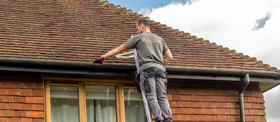 our team cleaning the gutters on a house in Yateley